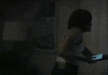 a blurry picture of a person standing in the dark