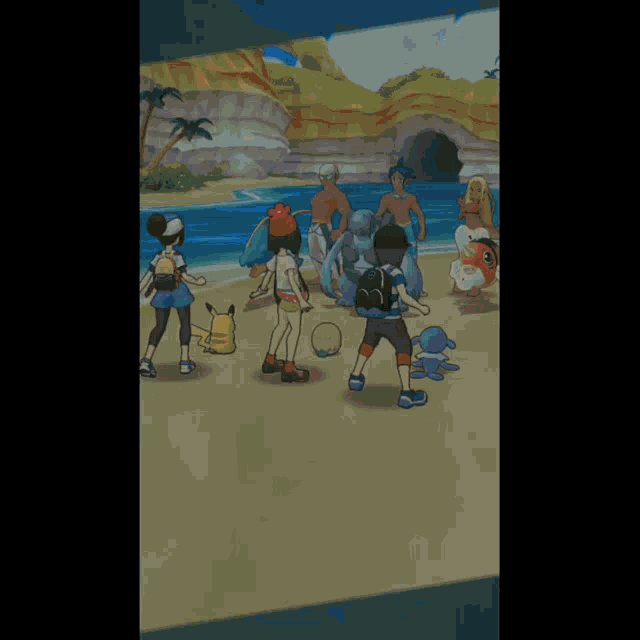 a group of people are standing on a beach playing a video game