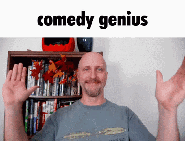 a bald man is standing in front of a bookshelf with the words comedy genius written above him