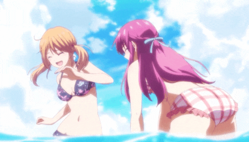 two girls in bikinis are standing in the ocean