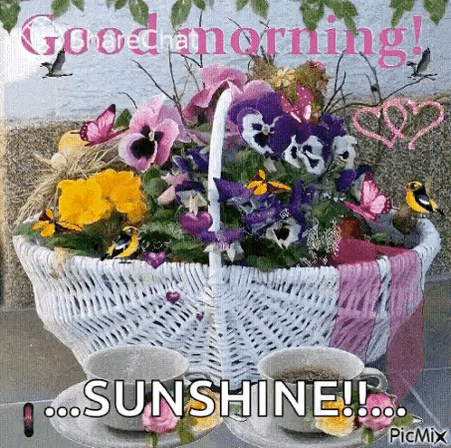 a basket of flowers and two cups of coffee with the words good morning sunshine written on it .