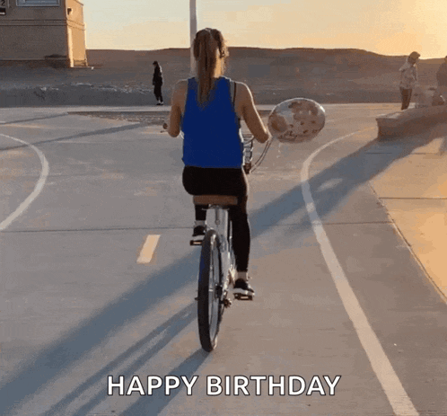 a woman is riding a bike while holding a balloon and the words happy birthday are written on the bottom