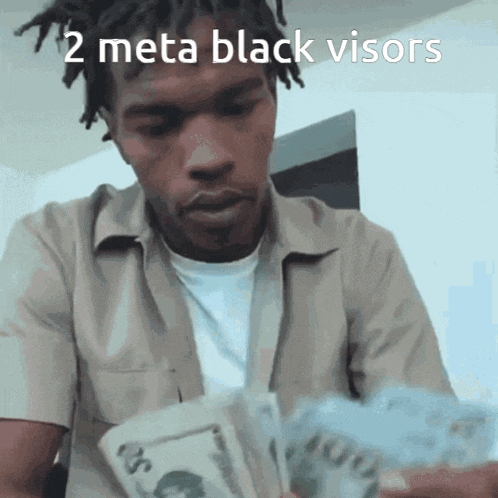 a man is holding a bunch of money with the caption " 2 meta black visors "