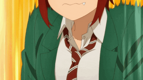 a girl with red hair is wearing a tie and a green jacket