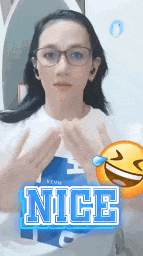 a woman wearing glasses and a shirt that says nice on it
