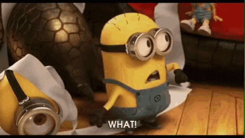 a minion is standing next to a roll of toilet paper and saying what