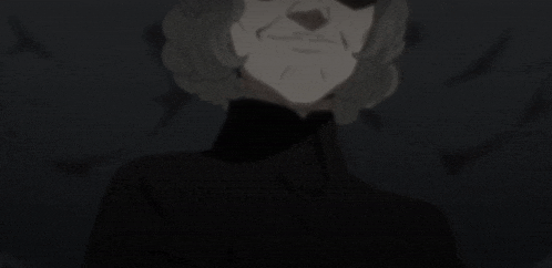 a woman in a black turtleneck is making a stop gesture with her hand