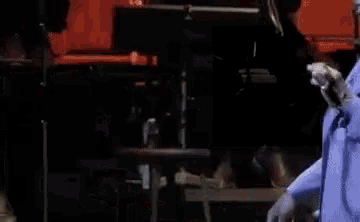 a blurred image of a person playing a piano