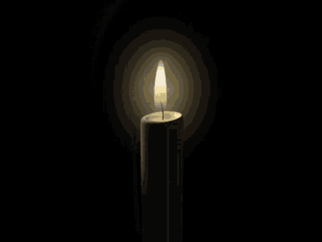 a candle with a sticker on it that says sonic