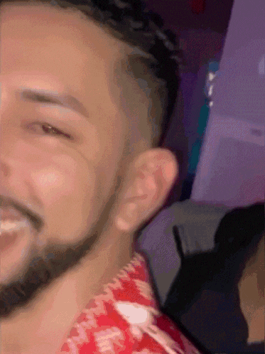 a close up of a man 's face with his eyes closed