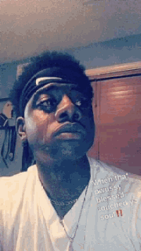 a man wearing a headband with the words when that pussy blessed touched my soul written on it