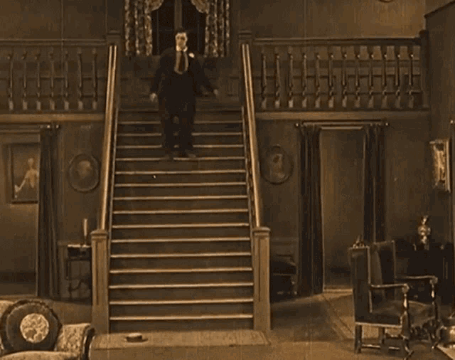 Buster Keaton Slide GIF - Buster Keaton Slide Stairs Fall GIFs