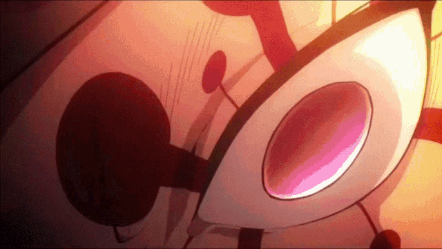 a close up of a cartoon character 's eyes with a pink circle in the middle of them .