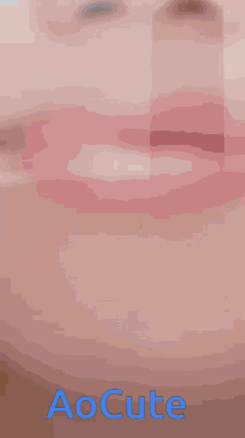 a close up of a woman 's face with the words " aocute " on the bottom