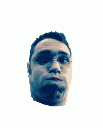 a man with glasses looks up at the camera