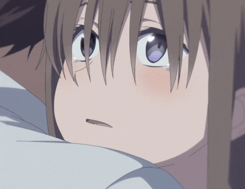 a close up of a girl 's face with a blue eye