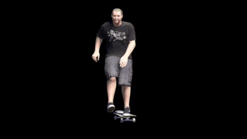 a person wearing vans shoes is riding a skateboard on a black background