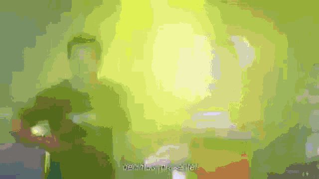 a blurred image of a person with a green shirt and a yellow light behind them that says ' drinks & alcohol '