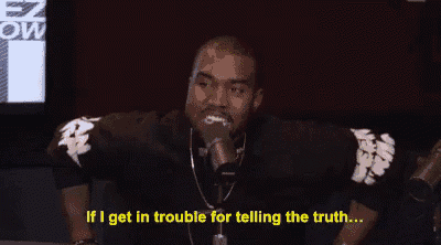 a man is sitting in front of a microphone and saying if i get in trouble for telling the truth .