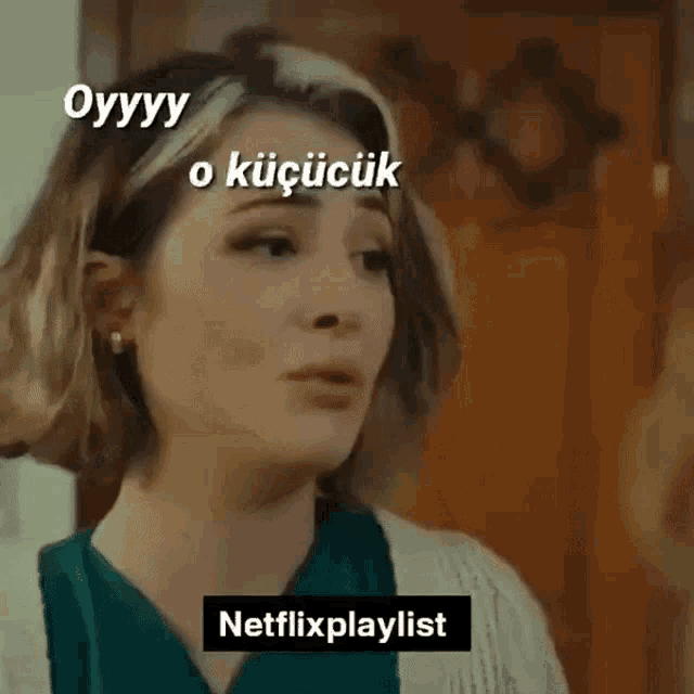 a woman in a green shirt is talking to a man in a white sweater and the words netflixplaylist are above her