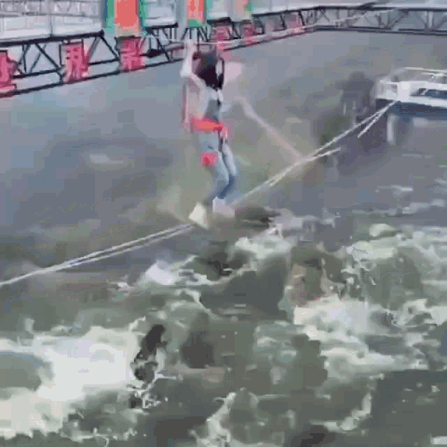 a person is jumping into a body of water