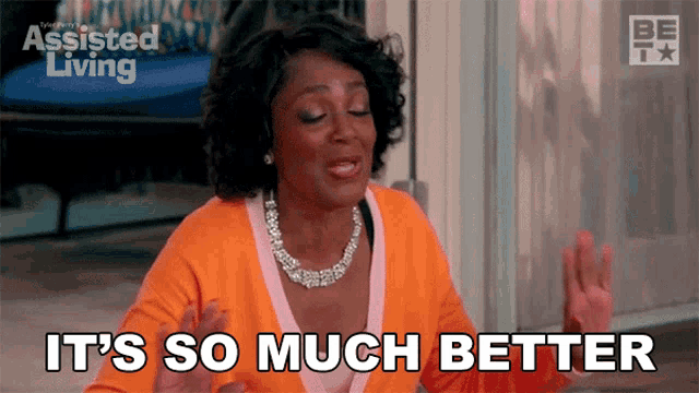 a woman says it 's so much better while wearing an orange top