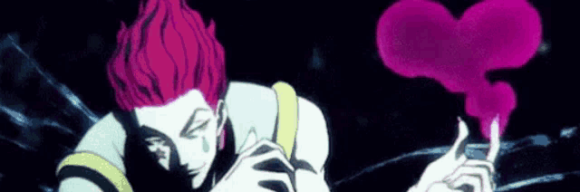 a man with red hair is holding a pink heart shaped object in his hand .