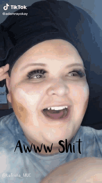 a woman is making a funny face with the words awww shit written below her