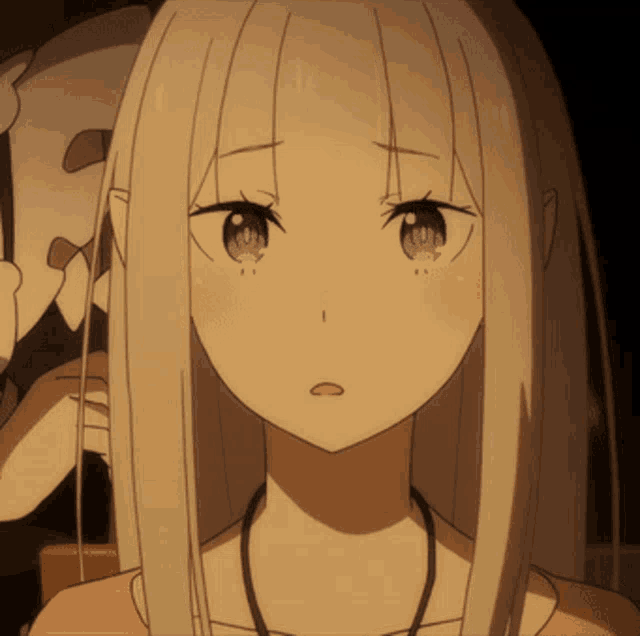 a close up of a girl 's face with long white hair