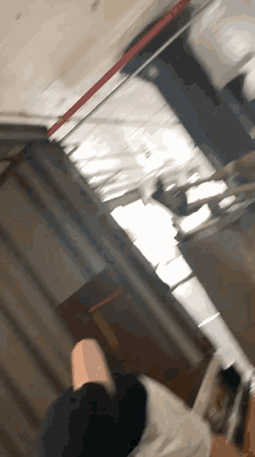a blurry picture of a person 's feet in a room