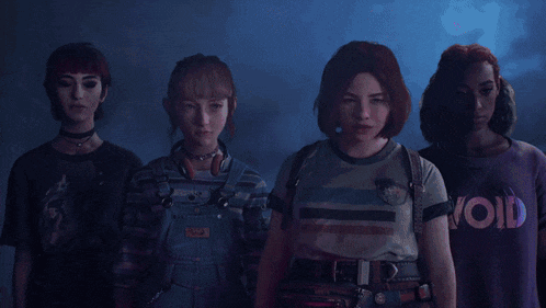 a group of women standing next to each other with one wearing a shirt that says " void "