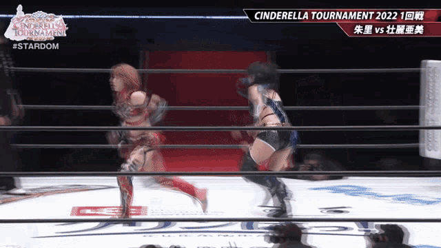 two women wrestling in a ring with the words cinderella tournament 2022 on the screen