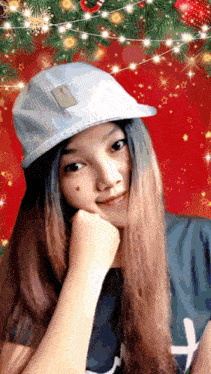 a girl wearing a hat and a shirt with the letter h on the front
