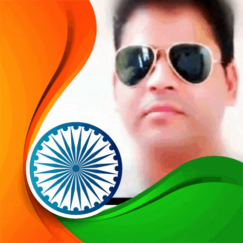 a man wearing sunglasses stands in front of a flag