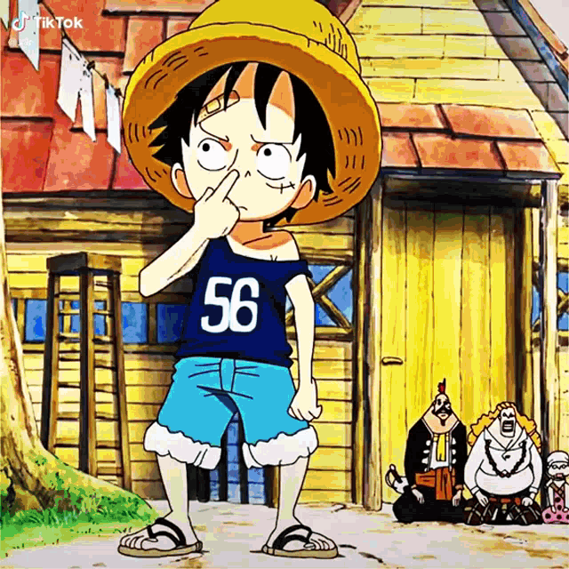 monkey d luffy from one piece is wearing a blue shirt with the number 56 on it .