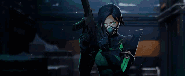 a woman in a gas mask is holding a gun in her hand .