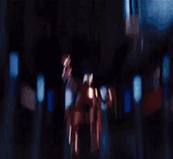a blurry picture of people standing in front of an american flag