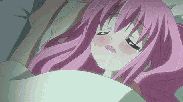 a girl with pink hair is laying on a bed
