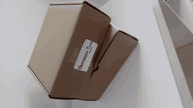 a cardboard box with a label that says champagne bread