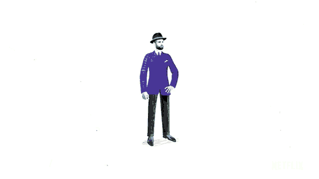 a man wearing a black hoodie and yellow pants is standing on a white background .