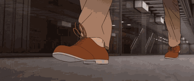 a drawing of a person 's feet with brown shoes