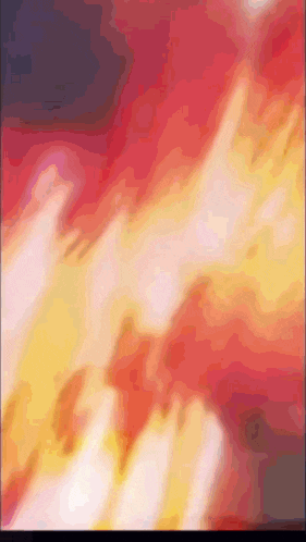 a blurred image of a fire with a purple background