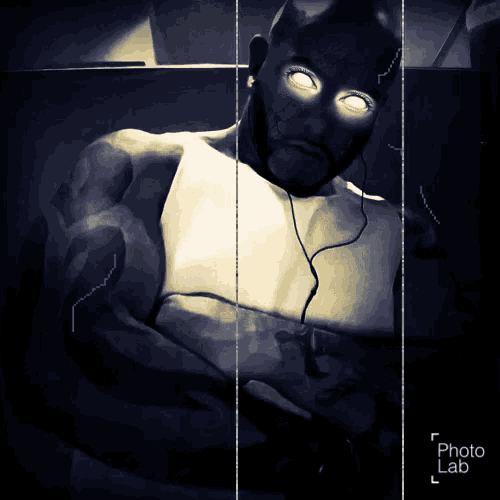 a black and white photo of a man with glowing eyes