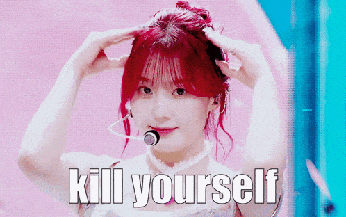 a girl with red hair has the words kill yourself written on her face
