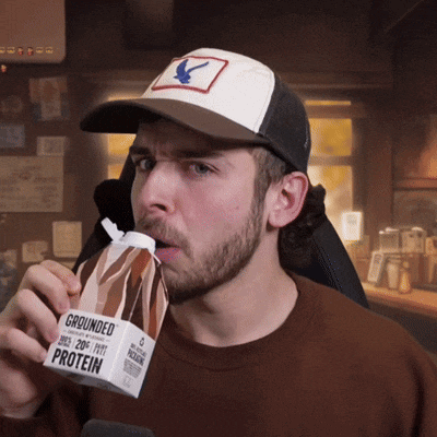 a man is drinking grounded protein from a box