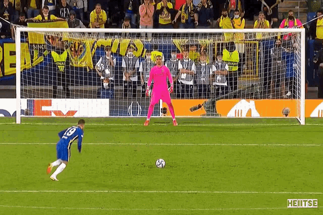 a soccer player wearing number 19 is kicking a ball