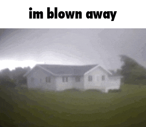 a blurred picture of a house with the words `` im blown away '' written on it .