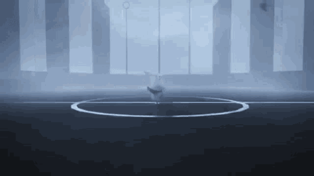 a cartoon character is standing in a circle in a dark room with a lot of windows .