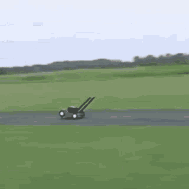 a person is flying through the air on a rc plane .