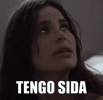 a close up of a woman 's face with the words `` tengo sida '' written on her face .